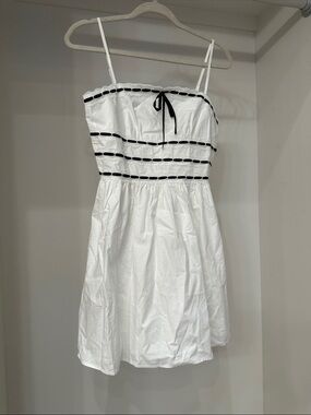 Pink Lily small White Spaghetti Strap Dress with Black Trim.  Like new
